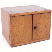 Vintage oak table-top 2-drawer cabinet, with inset brass handles, containing various stationery