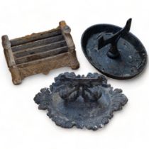 An ornate Victorian cast-iron boot scraper, 36cm across, and 2 others