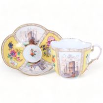 An Antique Dresden quatrefoil cup and saucer, yellow body and painted panels with roses and shipping