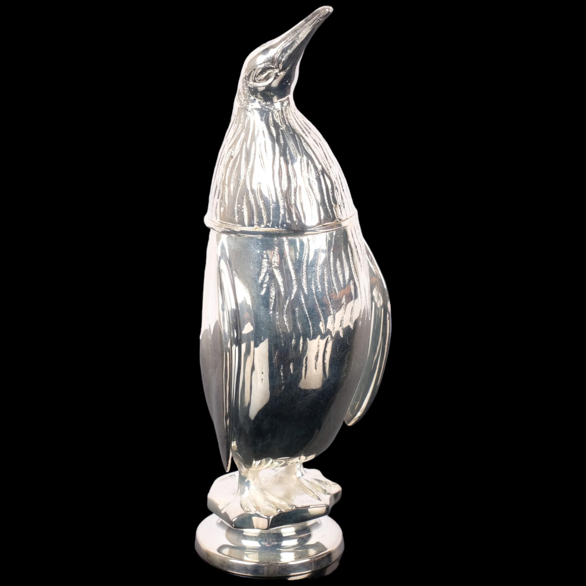 A modern silver plated penguin design pepper pot, H18.5cm