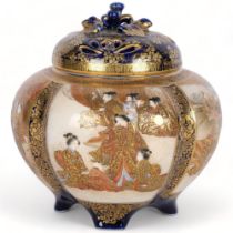 A Japanese ceramic censer of lobed form, with painted and gilded panels, and gilded blue cover,