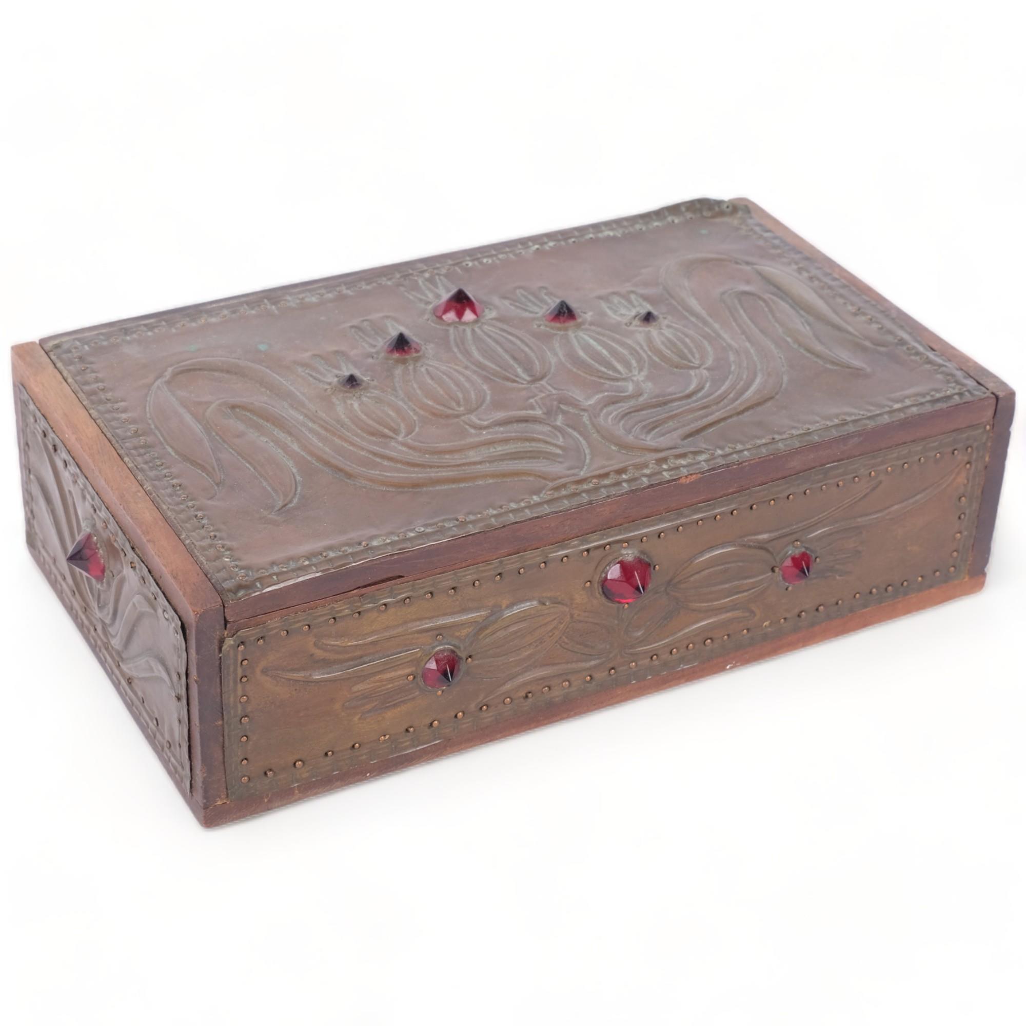 An Art Nouveau copper-clad box, with inset red stones (A/F), 21.5cm across