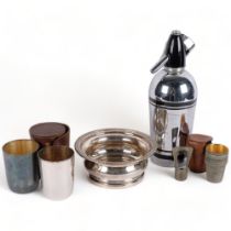 A Vintage soda syphon, a pair of silver plated travelling beakers, in associated casing, beaker