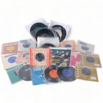 A shoe boxful of 7" vinyl records, various artists and genres, including Simon & Garfunkel, Booker