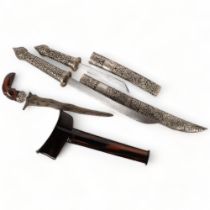 A small Indonesian kris dagger and scabbard, dagger length 27cm, together with a graduated pair of