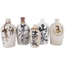 5 various Japanese Sake bottles with inscriptions, 26.5cm