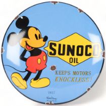 A reproduction circular enamel sign, Sunoco Motor Oil, with Mickey Mouse caricature, diameter 30cm