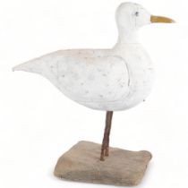 A large carved and painted wood study of a seagull on stand, H46cm