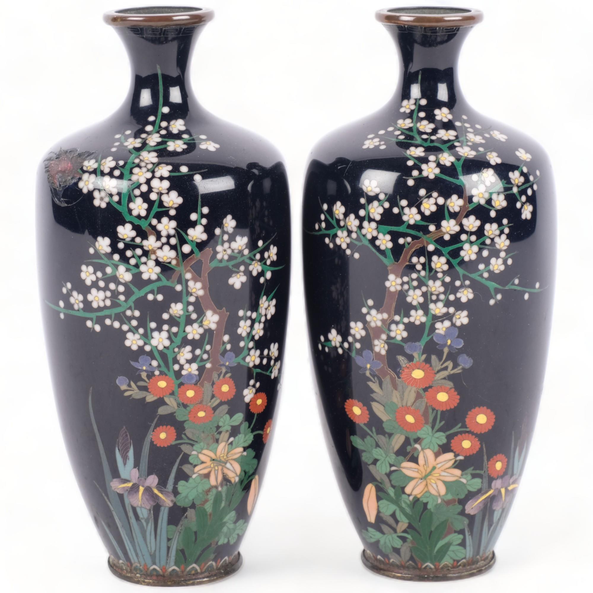 A pair of blue ground Antique cloisonne vases, with blossom and floral decoration (some damage),