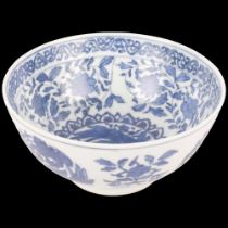 A blue and white Chinese porcelain bowl, with bird and floral design and 6 character mark, 15cm