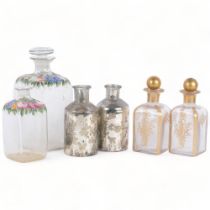 A 19th century French enamelled glass decanter and stopper, matching smaller decanter with no