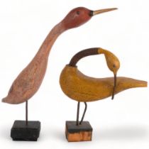 2 stylised carved and painted wood studies of ducks on stands, tallest 48cm
