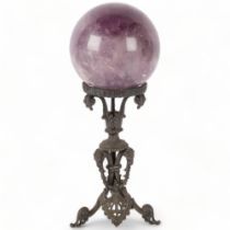 A large amethyst spherical ball, on decorative wrought-iron stand, H33cm