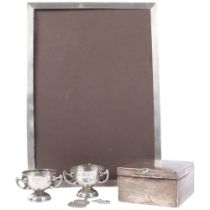 A large Art Deco rectangular silver-fronted photo frame, overall 30cm x 22cm, silver cigarette