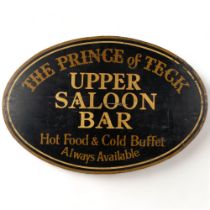 A painted wood oval sign, advertising the Prince of Teck Saloon Bar, 81cm across
