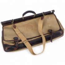 Holland & Holland London - A Vintage leather-trimmed canvas holdall, with multiple pockets, titled
