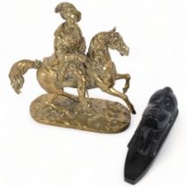 A cast-brass Cavalier on horseback, 27cm, and an African ebony wall mask