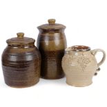 2 glazed stoneware pots and covers, tallest 36cm, and a jug with moulded grapevine decoration