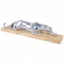 A large polished Aluminium study of a jaguar, on stand, overall length 56cm