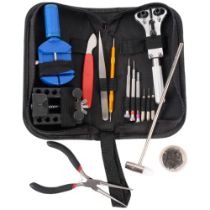 A watchmaker's starter repair kit, including jaxa style caseback opening tool, pliers, screwdrivers,