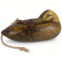 A large carved and painted wood decoy duck, L40cm, with hanging chain