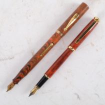 A Watermans marble bodied fountain pen, with a 9ct gold band around the lid, nib is not gold, and