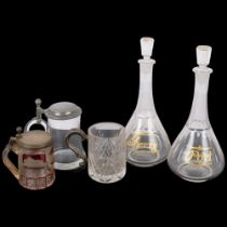 A pair of Sherry and Port decanters and stoppers, 29cm, German ruby overlay and engraved glass