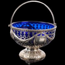 An Edwardian silver pedestal swing-handled sugar bowl, George Nathan & Ridley Hayes, Chester 1901,