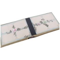 An Antique Japanese photograph album, with applied bird and snake decoration (A/F) with painted