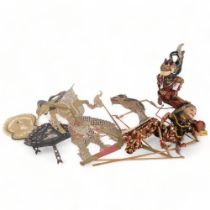 A group of Vintage Oriental shadow puppets, with associated fans depicting shadow puppets