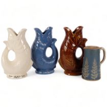 A group of 3 gurgle jugs, largest height 24cm, various colours and inscriptions, and a fir tree