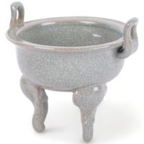 A Chinese celadon crackle glaze censer, on tripod support, 11.5cm across