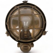 A Vintage brass-cased ship's bulkhead lamp, with dome glass lens, H31cm overall (glass cracked)