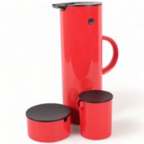 ERIC MAGNUSSEN for STELTON, DENMARK - a 3-piece red plastic set, comprising a vacuum jug, EM77,