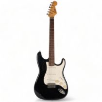 A Squire Strat by Fender electric guitar, black body, no serial no.