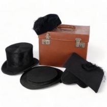 A leather hat box containing a top hat by R W Forsyth, a Cambridge mortar board, and an opera hat (