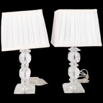 A pair of modern decorative bevelled perspex table lamps, with white shades, H40cm