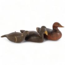 A group of 3 carved and painted wood decoy ducks