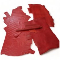 4 rolls of various red leather, widest 148cm