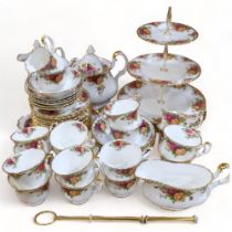 Royal Albert Old Country Roses teaware, matching dinner plates and sauce boat, and cake stand