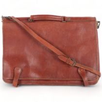 A Vintage leather satchel, with 4 inside compartments, no identifiable maker's label