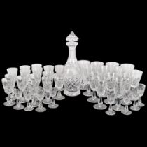 A Waterford Crystal decanter and stopper, 33cm, and a suite of matching glasses, comprising 7 wine