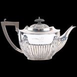 A George V silver teapot, Alexander Clark & Co Ltd, Birmingham 1912, oval form with relief