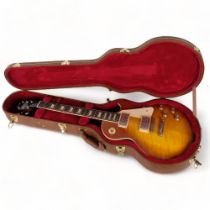 A Gibson Les Paul Studio electric guitar, made in the USA, serial no. 212620336, with associated