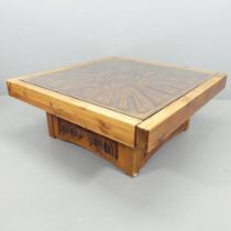 A mid-century brutalist pine coffee table. 107x43cm