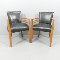 A pair of Design American Spinneybeck Knickerbocker Pull Up chairs in the manner of Gilbert Rohde,