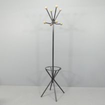 A mid-century atomic hat and coat stand in the manner of Roger Feraud, with wooden ball ends on