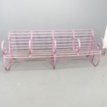 A Victorian strap iron four-seater garden bench with scrolled armrests. Overall 215x81x64cm, each