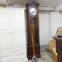An Art Deco oak-cased longcase clock, with two weights and pendulum. 47x210x27cm.