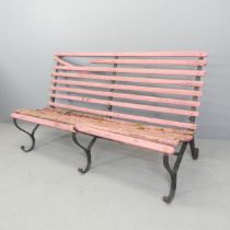 An antique painted teak slatted garden bench on folding wrought iron frame. 153x86x62cm. Slats A/F.